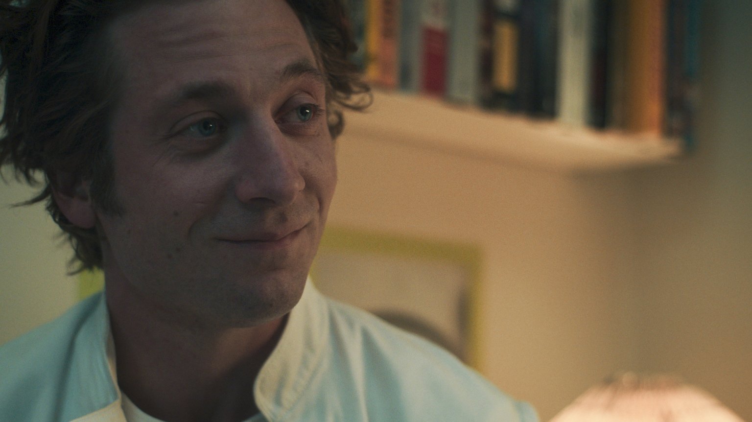 Jeremey Allen White, playing Carmen "Carmy" Berzatto, smiles. 