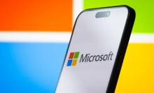 The logo of Microsoft Corporation is displayed on a smartphone screen, with the company's colorful branding visible in the background, on April 26, 2025, in Chongqing, China. Microsoft is a leading American multinational technology company, known for its Windows operating system, Microsoft Office software suite, Azure cloud services, and other enterprise and consumer technology products.