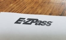 ez-pass logo on a white sheet of paper on a table
