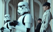 Stormtroopers and Imperial commanders look towards the crowd on Ghorman
