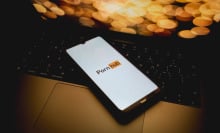 The Pornhub logo is being displayed on a smartphone
