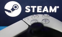 a gaming controller in front of the steam logo