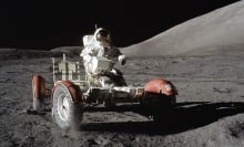 Apollo 17 astronaut driving a moon buggy