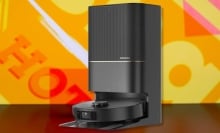 The DREAME X40 Ultra Robotic Vacuum on an orange background