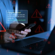 Businessman holding phone with scam message on digital screen