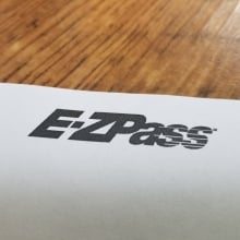 ez-pass logo on a white sheet of paper on a table