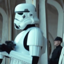 Stormtroopers and Imperial commanders look towards the crowd on Ghorman