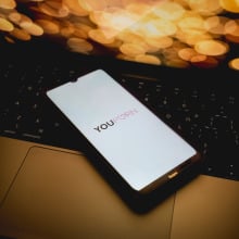 The Youporn logo is being displayed on a smartphone screen