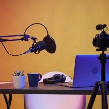 a microphone, tripod and camera in home studio