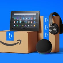 amazon boxes and devices on blue background