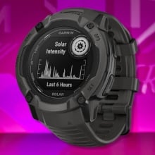 The Garmin Instinct 2X Solar Smartwatch on a purple background
