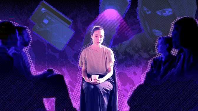 Woman sits in front of people listening empathetically.