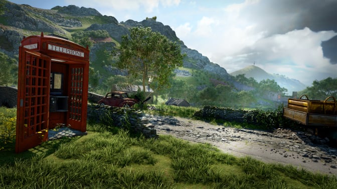 A detailed countryside landscape featuring a classic red British telephone booth with an open door in the foreground. The booth appears aged and weathered. Nearby, there is an abandoned rusted car and a stone wall lining a rough dirt road. Rolling green hills, scattered houses, and a distant mountain with a communications tower are visible under a partly cloudy sky. The scene evokes a sense of mystery and abandonment.