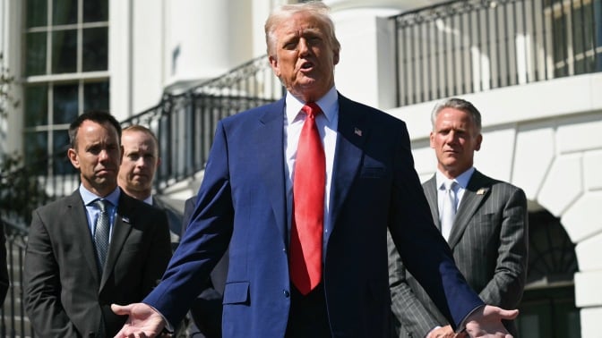 donald trump addresses the media on the South Portico of the White House