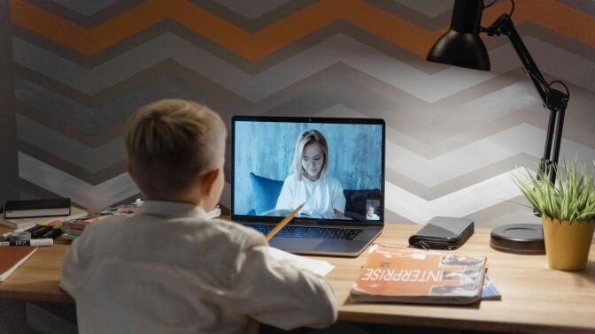 Boy looking at laptop
