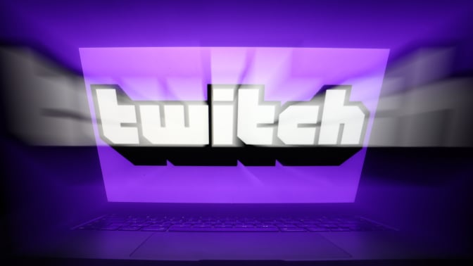 Twitch logo displayed on a laptop screen.