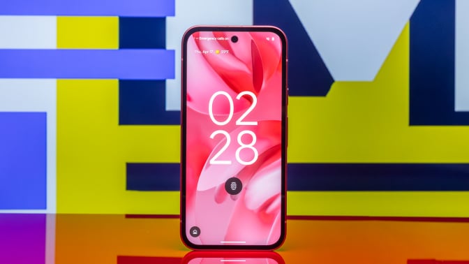 Google Pixel 9a against colorful background