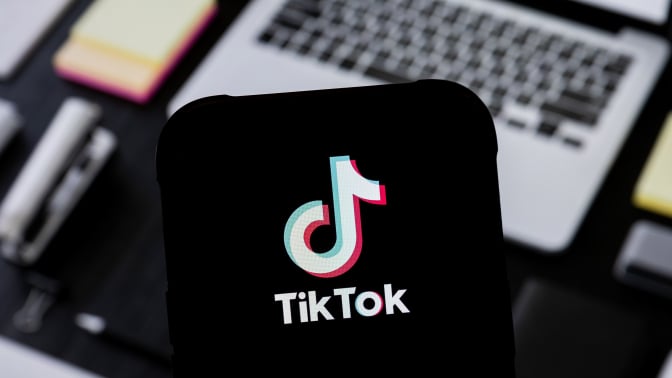 In this photo illustration, a TikTok logo seen displayed on a smartphone. 