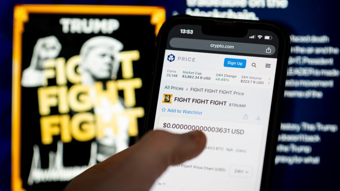 User buying $TRUMP on mobile device with memecoin website in the background