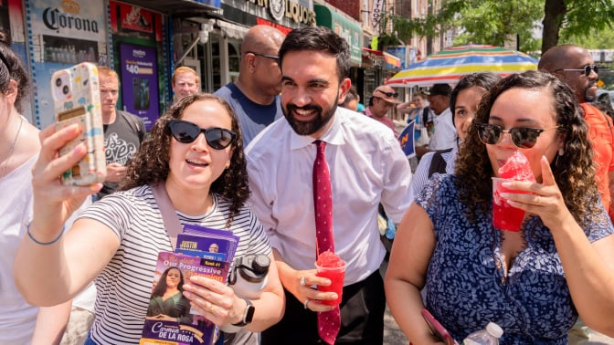 Zohran Mamdani, New York City mayoral candidate, center, greets supporters during a campaign event in New York.