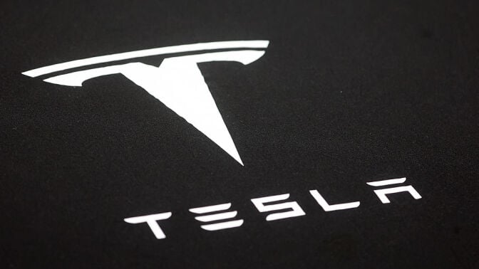 Tesla logo against black background