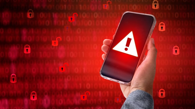 Hacker in a blue hoody standing in front of a coding background with binary streams and information security terms cybersecurity concept