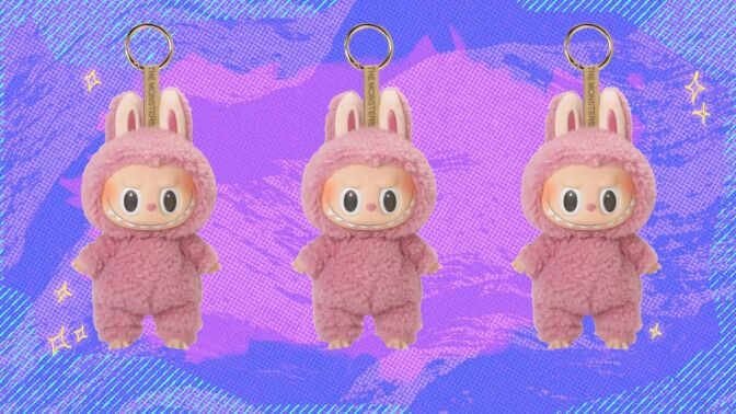 three pink labubu keychains on a patterned background