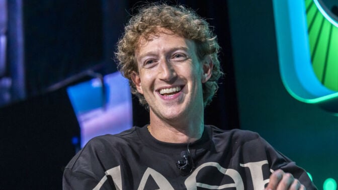 Mark Zuckerberg smiling at an event on stage