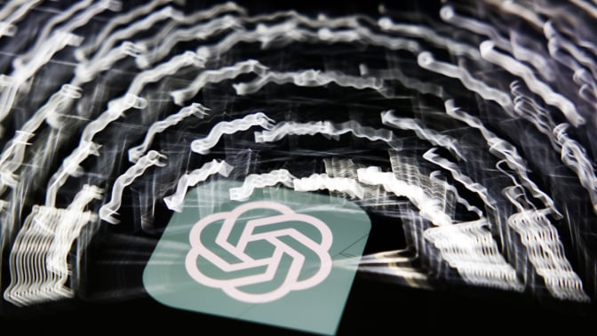 A multi-exposure shot of the ChatGPT logo and glowing keyboard keys.