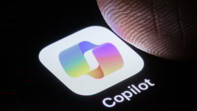 A finger taps on the CoPilot app.