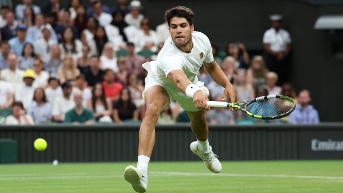 Carlos Alcaraz of Spain plays a backhand