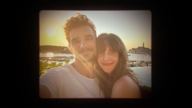 A photo shows a smiling couple.