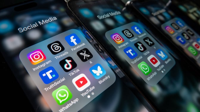 iPhone screens display various social media apps on the screens. Threads, Instagram, Twitter, X, Meta, Facebook