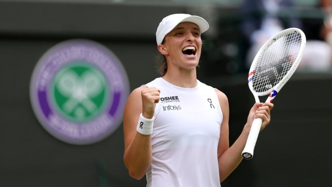 Iga Swiatek of Poland celebrates match point