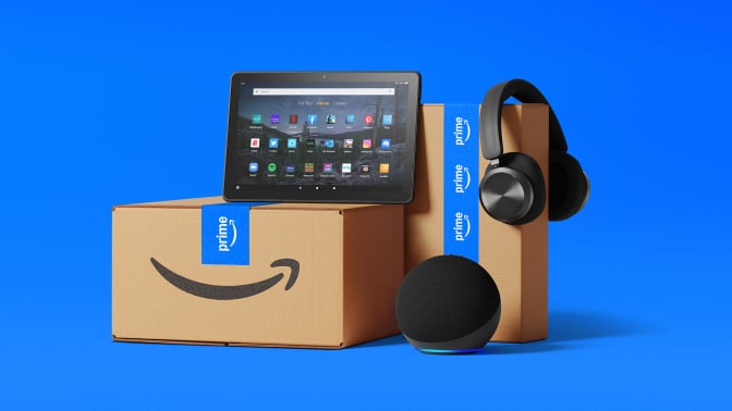 amazon boxes and devices on blue background