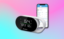 GoveeLife Smart Air Quality Monitor next to a smartphone with the Govee Home app