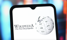 A phone screen with the Wikipedia logo.