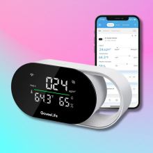 GoveeLife Smart Air Quality Monitor next to a smartphone with the Govee Home app