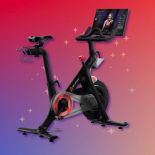 Peloton bike with blue and red background