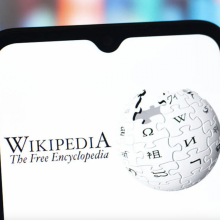 A phone screen with the Wikipedia logo.